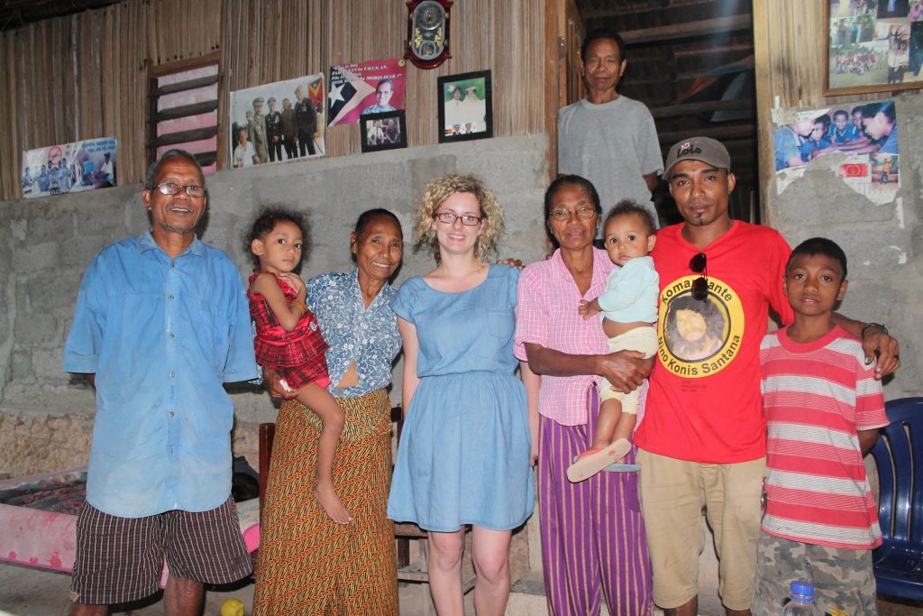 Hannah Loney with one of her interview participants and family in Baucau, Timor-Leste. Photograph by Joaquim Borges.