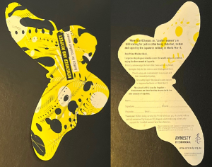 Butterfly shaped postcards with a yellow design on one side and information on the obverse.